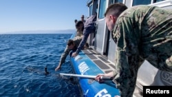 FILE - Sailors from Jordan and other nations retrieve an unmanned undersea drone during a military exercise in the Gulf of Aqaba, Jordan, on February 8, 2022 (U.S. Naval Forces Central Command/2nd Class Dawson Roth/Handout via REUTERS)