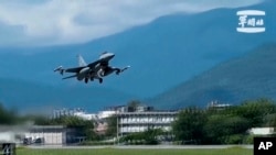 FILE - An F-16 takes off from Hualien Airbase in Taiwan's southeastern Hualien county, Aug. 20, 2023, in this grab from video released by the Taiwan Military News Agency. . 