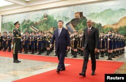 FILE PHOTO: Chinese President Xi Jinping and Maldivian President Mohamed Muizzu attend a welcome ceremony at the Great Hall of the People in Beijing, Jan. 10, 2024. (cnsphoto via Reuters)