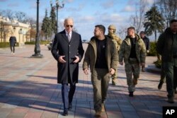 US President Joe Biden, left, and Ukrainian President Volodymyr Zelenskyy walk during an unannounced visit in Kyiv, Ukraine, Feb. 20, 2023. (Ukrainian Presidential Press Office via AP)