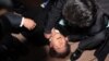 South Korean opposition party leader Lee Jae-myung is attended to after being attacked in Busan, Jan. 2, 2024. 