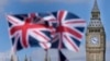资料照：英国议会大厦与英国国旗