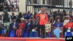 FILE - General Brice Oligui Nguema (C), Gabon's interim president, salutes during a military parade in Libreville, Sept. 4, 2023.