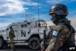 FILE - A peacekeeper of the United Nations Organization Stabilization Mission in the Democratic Republic of the Congo (MONUSCO) looks on at the force's base during a field training exercise in Sake, eastern Democratic Republic of Congo, Nov. 6, 2023.