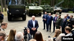Belarusian President Alexander Lukashenko speaks to journalists during his visit to a military-industrial complex facility in the Minsk Region, Belarus, June 13, 2023. (Press Service of the President of the Republic of Belarus/Handout via Reuters)
