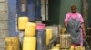 A water vendor fills up jerry cans at a water point at the Mathare slum in Nairobi, Kenya, March 22, 2023.