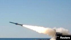 Photo shows missile launched during training exercise from an unknown location. Iran has equipped its Revolutionary Guards' navy with drones and 1,000-km (600-mile) range missiles.