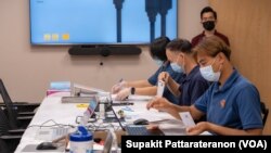 Officers sort received overseas absentee ballots, preparing to pack in diplomatic pouches and send them back to count in Thailand at the Royal Thai Consulate-General of Los Angeles, CA.