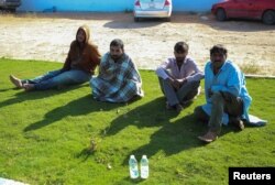 Migrants rescued by the Libyan Coast Guards in the Mediterranean Sea arrive in Garaboli, Libya, April 25, 2023.