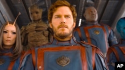 From left, Pom Klementieff as Mantis, Groot (voiced by Vin Diesel), Chris Pratt as Peter Quill/Star-Lord, Dave Bautista as Drax, Karen Gillan as Nebula are seen in a scene from "Guardians of the Galaxy Vol. 3." (Marvel-Disney via AP)
