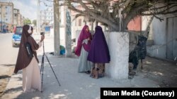 FILE - Journalists from the Somali women-led newsroom Bilan are seen on assignment. (UNDP/2022/Said Fadhaye)