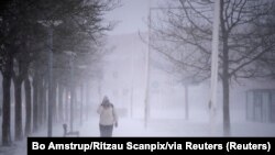 A person walks amid heavy snowfall in Randers, Denmark, Jan. 3, 2024. (Bo Amstrup/Ritzau Scanpix via Reuters)