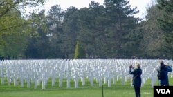Tourists visit the Normandy American Cemetery in Colleville-sur-Mer, Normandy, France. Roughly 73,000 Allied forces died during the nearly three-month Battle of Normandy in 1944. (Lisa Bryant/VOA)