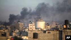 Smoke rises from the town of Khan Younis after Israeli strikes, Dec. 15, 2023. 