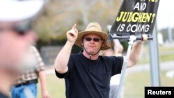FILE - An anti-abortion activist shouts at patients arriving at a health center in Clearwater, Florida, Feb. 11, 2023. The Florida Supreme Court this week issued two rulings that virtually guarantee that the issue of abortion will be top of mind for many voters in November.