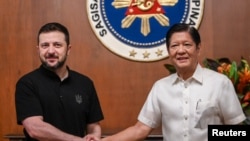 Ukrainian President Volodymyr Zelenskyy shakes hands with Philippine President Ferdinand "Bongbong" Marcos Jr. at the Malacanang Palace in Manila, June 3, 2024. (Jam Sta Rosa/POOL via Reuters) 