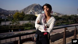 Peruvian singer Lenin Tamayo poses for a photo while taking a break from recording a music video in downtown Lima, Peru, Thursday, Aug. 3, 2023. (AP Photo/Martin Mejia)