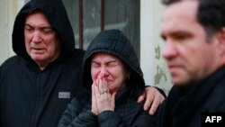 Relatives mourn during the funeral of a victim of a cyclone that hit Mucum, Rio Grande do Sul, Brazil, during his funeral in the city's cemetery, on Sept. 9, 2023. 