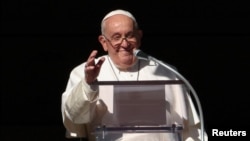 Pope Francis leads a prayer from his window at the Vatican, Dec. 17, 2023.