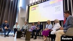 Speakers attend the New Belarus conference in Warsaw, Poland, Aug. 6, 2023. 