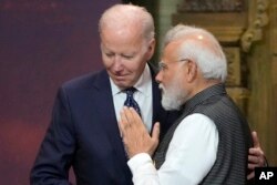 FILE - U.S. President Joe Biden, left, and India Prime Minister Narendra Modi talk during the G20 leaders summit in Nusa Dua, Bali, Indonesia, Nov. 15, 2022. Modi arrives in the U.S. on Wednesday.