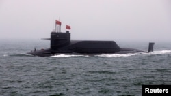 FILE - Chinese Navy's nuclear-powered submarine Long March 11 takes part in a naval parade off the eastern port city of Qingdao, China on April 23, 2019. (REUTERS/Jason Lee)