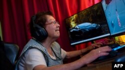 María Elena Arévalo, 81, plays Free Fire, a popular online video game, at home at her home in Llay-Llay, Valparaiso Region, Chile, on Dec. 19, 2023. 