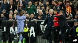 FILE - Real Madrid's Vinicius Junior reacts during a LaLiga soccer match between Valencia and Real Madrid at the Mestalla Stadium in Valencia, Spain, March 2, 2024.