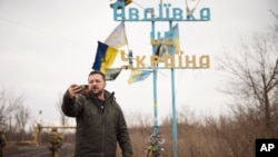 In this photo provided by the Ukrainian Presidential Press Office, Ukrainian President Volodymyr Zelenskyy visits Avdiivka, the site of fierce battles with the Russian troops in the Donetsk region, Ukraine, Dec. 29, 2023. 