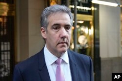 Michael Cohen leaves his apartment building on his way to Manhattan criminal court in New York, May 20, 2024.