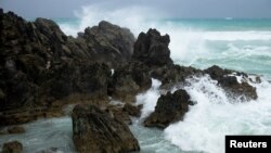 Waves crash against the South Shore as winds from Hurricane Ernesto approach Church Bay, Bermuda, Aug. 16, 2024. 