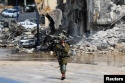 FILE - A view of a junction in the Sderot area, southern Israel, shows the aftermath of a mass-infiltration by Hamas gunmen from the Gaza Strip, Oct. 7, 2023.