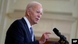 FILE - President Joe Biden speaks on the anniversary of the Inflation Reduction Act during an event in the East Room of the White House, Aug. 16, 2023, in Washington. 