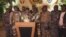 This image from video shows the spokesperson for Gabon's mutinous soldiers speaking on state television as he announces that the military had seized power in Libreville, Aug. 30, 2023. (GABON 24 via AP)