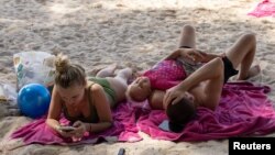 Russian tourists enjoy the beach in Phuket, Thailand, Dec. 26, 2022.