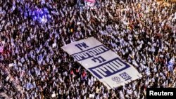Israelis take part in a demonstration against Israeli Prime Minister Benjamin Netanyahu and his nationalist coalition government's judicial overhaul, in Tel Aviv, Israel, Sept. 2, 2023. 