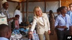 FILE - Jill Biden greets workers at a UNHCR screening center on the outskirts of Ifo camp outside Dadaab, eastern Kenya, 100 kms (60 miles) from the Somali border, Aug. 8, 2011.