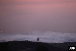 A picture taken from Israel's southern city of Sderot shows Israeli shelling of the northern Gaza Strip, Oct. 29, 2023