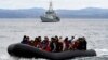 FILE - Migrants arrive accompanied by a Frontex vessel at Skala Sikaminias, on the Greek island of Lesbos, after crossing from Turkey, Feb. 28, 2020. Greece in May 2023 has ordered a probe of what some are calling an illegal roundup and pushback of migrants out to sea.