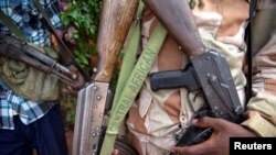 FILE - An armed fighter belonging to the 3R militia displays his weapon in the town of Koui, Central African Republic, April 27, 2017. The rebel group relaunched hostilities in the central African nation in July 2024. 