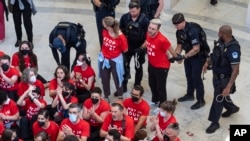 U.S. Capitol Police detain demonstrators protesting on July 23, 2024, the military policies of Israel a day before Israeli Prime Minister Netanyahu addresses the U.S. Congress. 