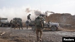 Israeli soldiers operate in the Gaza Strip, in this handout picture released on Dec. 14, 2023.