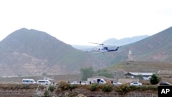 FILE - The helicopter carrying Iranian President Ebrahim Raisi takes off at the Iranian border with Azerbaijan after President Raisi and his Azeri counterpart Ilham Aliyev inaugurated dam of Qiz Qalasi, or Castel of Girl in Azeri, Iran, on May 19, 2024.