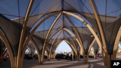Security forces stand guard outside a convention center hosting the IMF and World Bank annual meetings, in Marrakech, Morocco, Oct. 8, 2023. 