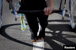 Rickshaw puller Yumeka Sakurai, 20, wears traditional tabi split-toed shoes during her driving lesson around the Asakusa district, Tokyo, Aug. 17, 2023.