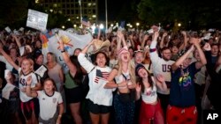 People celebrate while watching a live feed from Paris at the moment the International Olympic Committee awarded Salt Lake City the 2034 Winter Olympics, July 24, 2024, in Salt Lake City, Utah. 