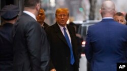 Former President Donald Trump leaves his apartment building in New York, Jan. 25, 2024.