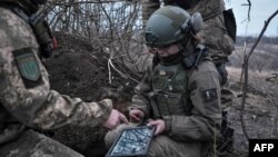 Soldiers of the Ukrainian Volunteer Army hold their positions at the front line near Bakhmut, Donetsk region, on March 11, 2023, 