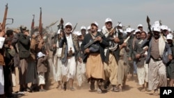 FILE - Houthi fighters march during a rally of support for the Palestinians in the Gaza Strip and against the US strikes on Yemen outside Sanaa on Jan. 22, 2024.