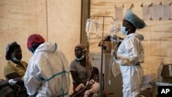 FILE - Health workers treat cholera patients at the Bwaila Hospital in Lilongwe central Malawi, Jan. 11, 2023.